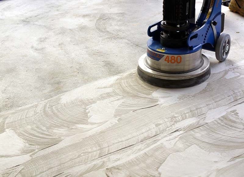 Machine grinding a concrete floor