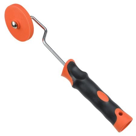 Grout wheel correction roller tool for decorative concrete applications.