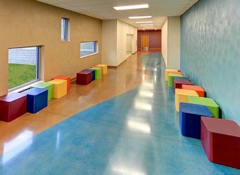 A smooth, polished concrete floor with a high shine, reflecting light and creating a spacious feel.