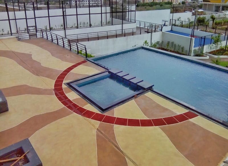 Spray textured concrete floor coating in a commercial space.