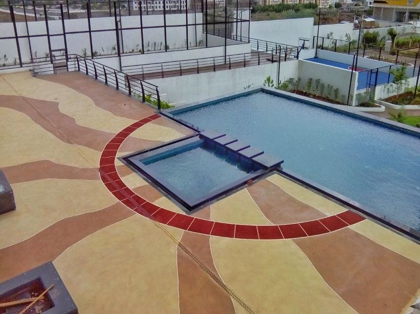 Spray textured hardscape in a landscaped area