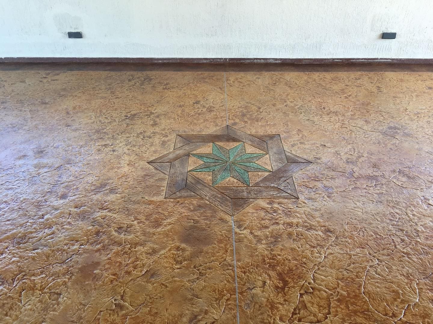 Decorative stamped overlay flooring finish