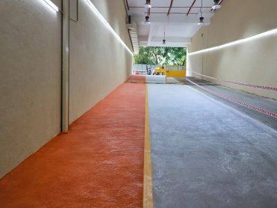 Spray texture flooring being applied to an interior surface in Pune, India.