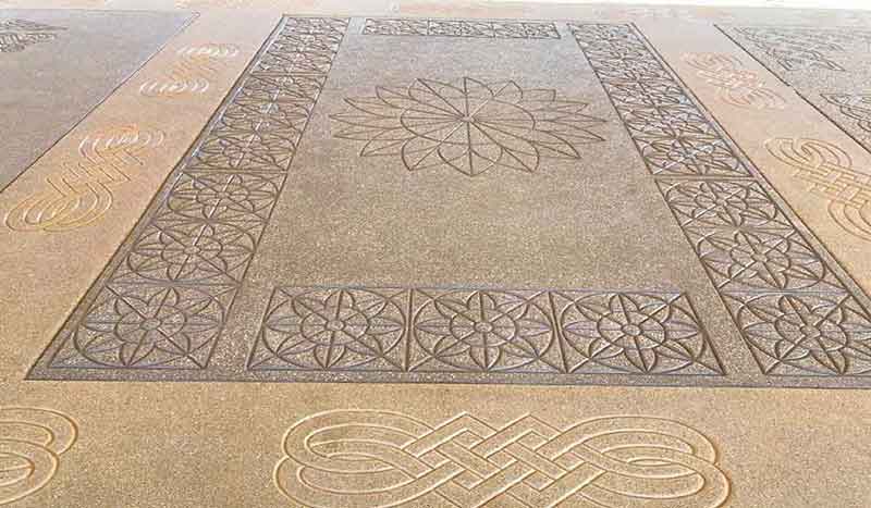 Designer stencil flooring being applied in a modern Pune home.