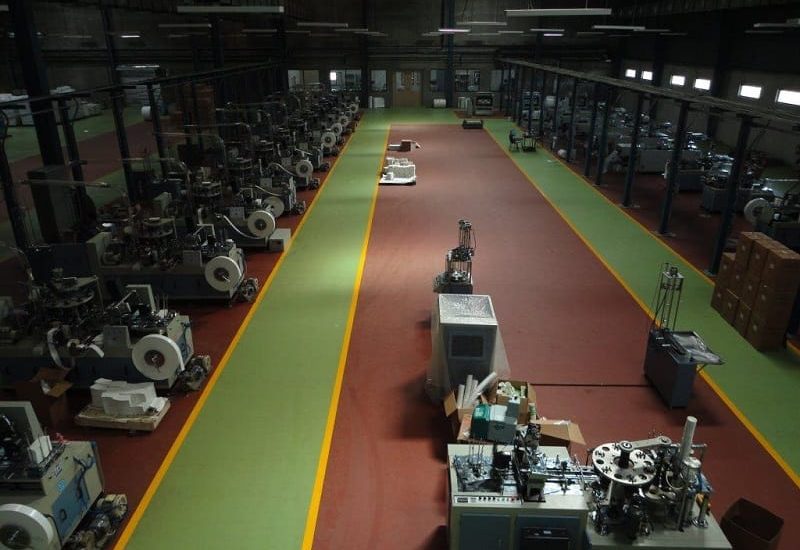 Durable epoxy floor coating being applied in an industrial warehouse in Pune, India.